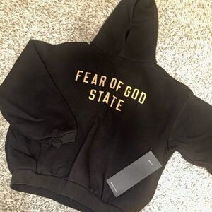 Fear of God Black Hoodie with Gold Lettering